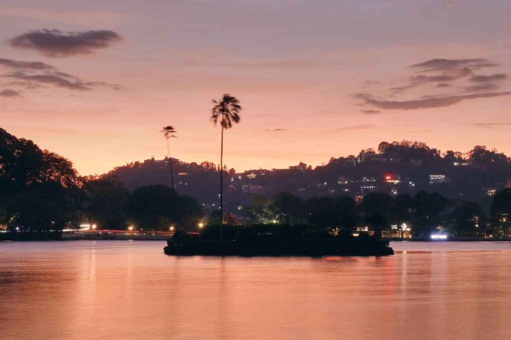 Red twilight over the lake in Kandy, Sri Lanka.